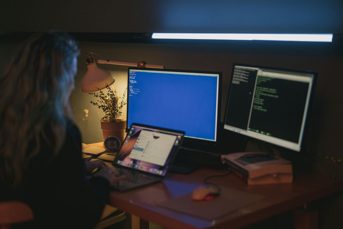 Reviewing tailored information security documentation on a laptop