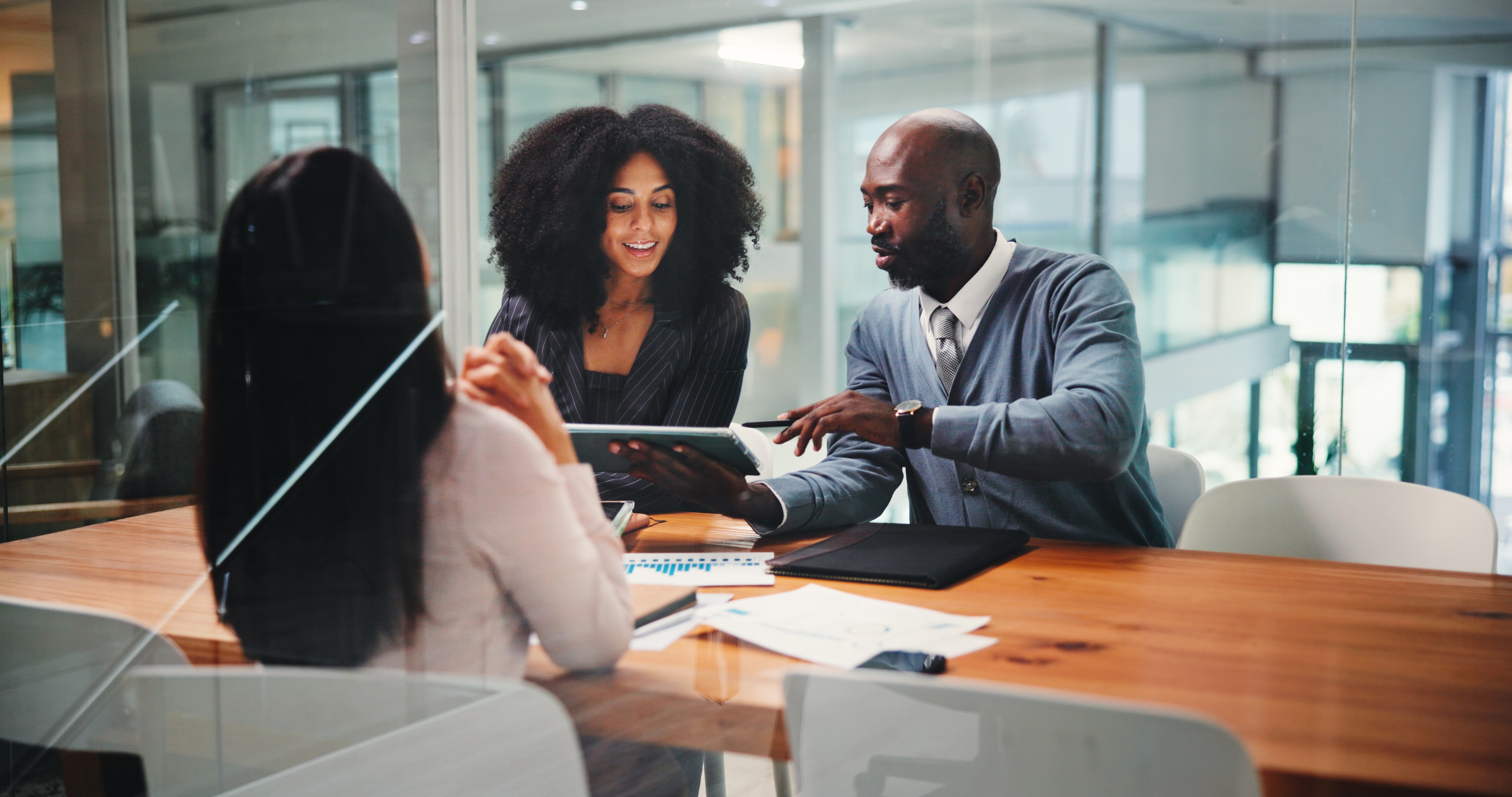 Information security and compliance team collaborating in a modern office